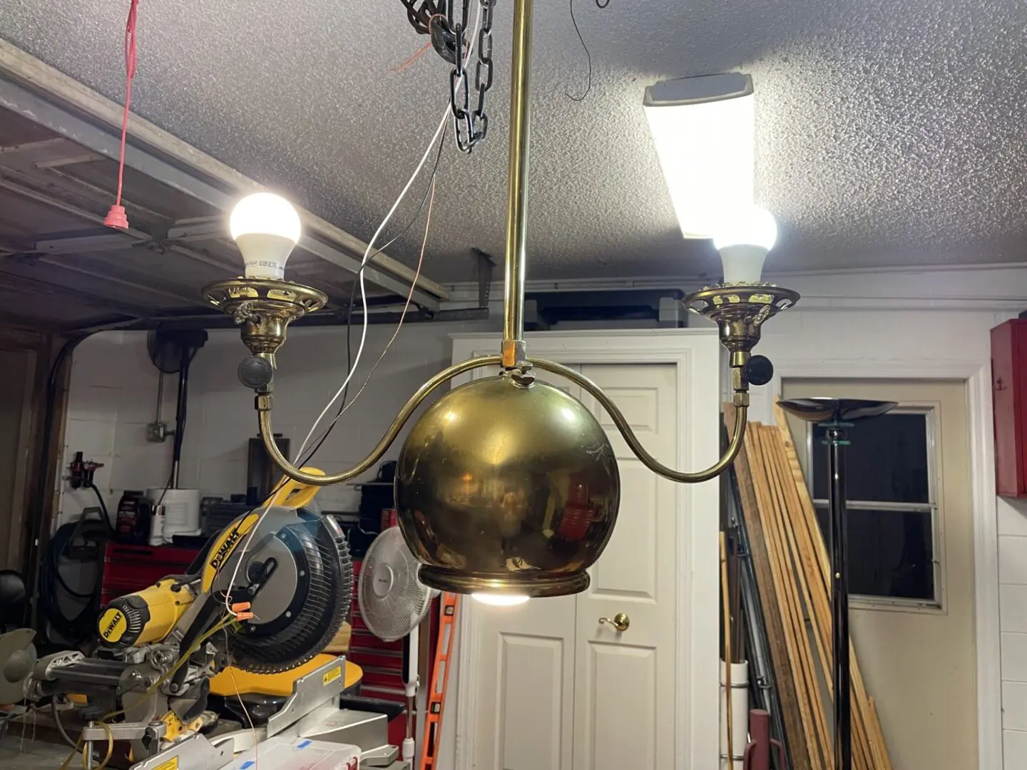 a golden color chandelier with two lights